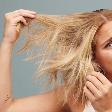 Blonde worrying on her damaged hair